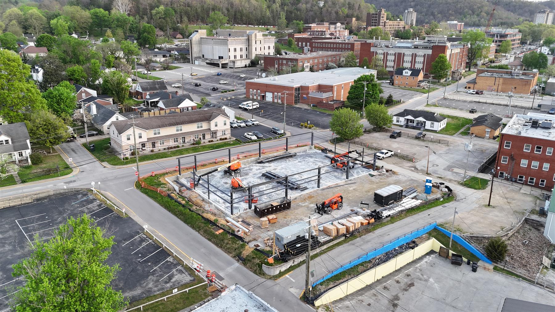 Aerial of the sheathed building frame, April 2026