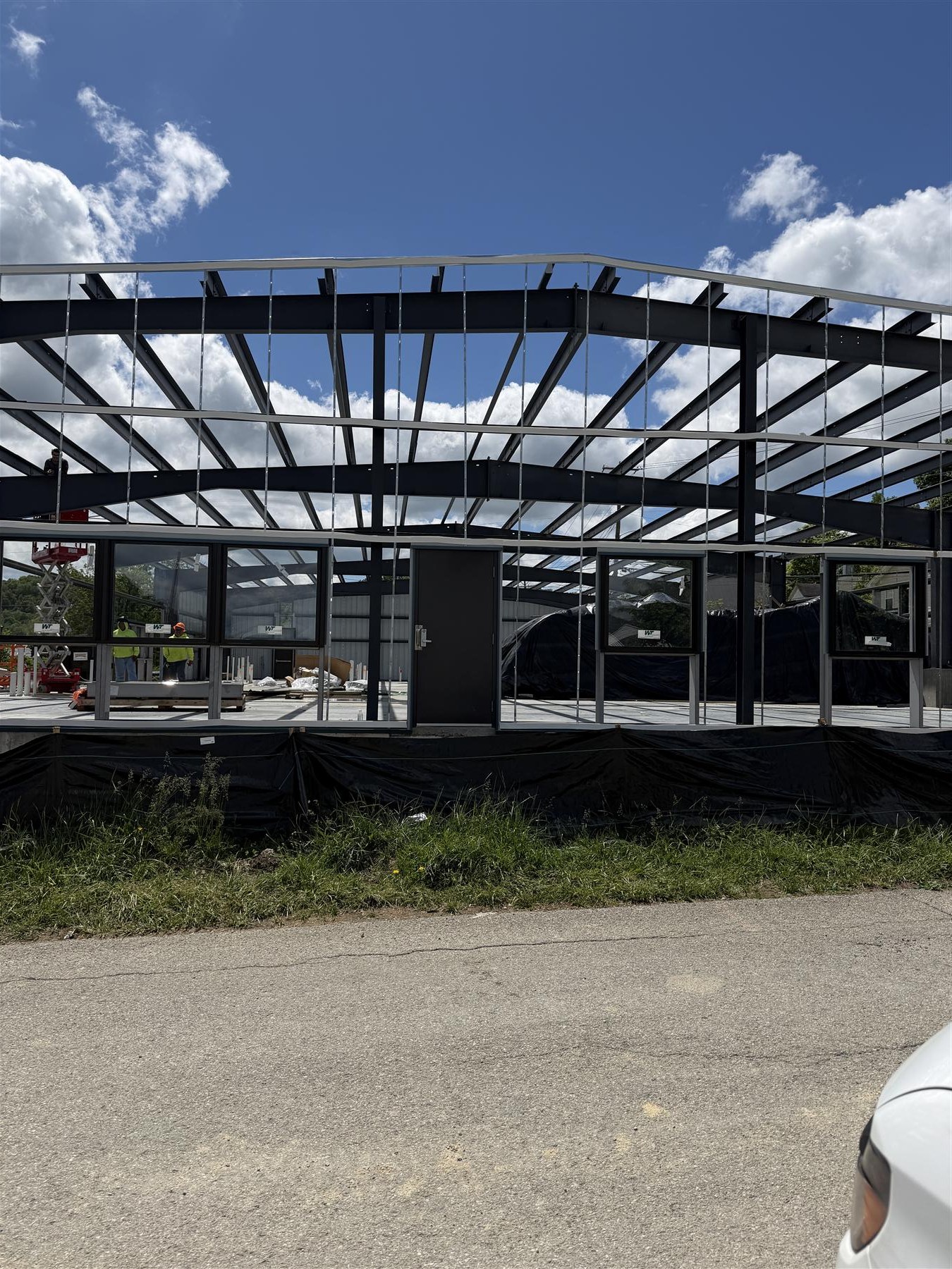 Roof panels on the pre-engineered metal building, April 2026